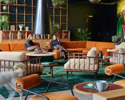 Open office area with people working.