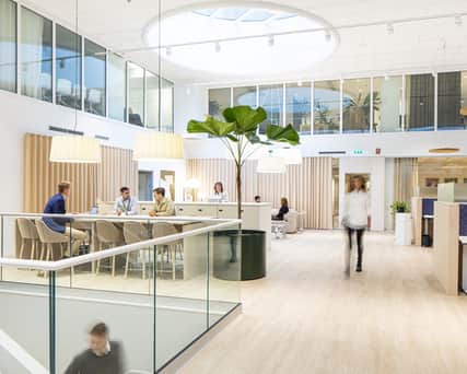 Open office area with people working.