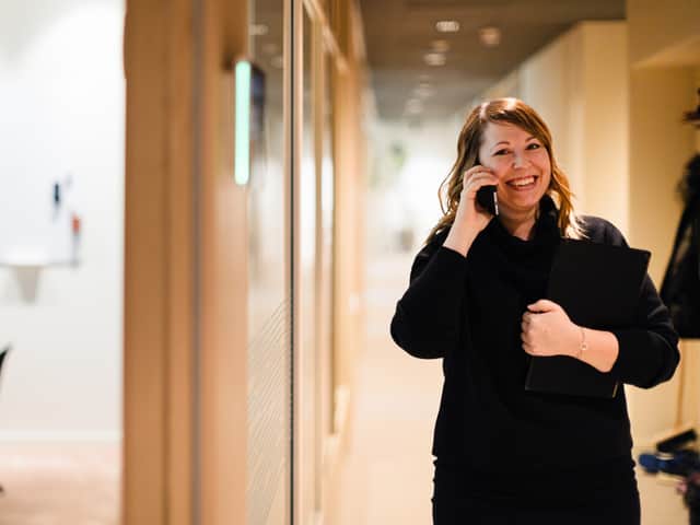 Person walking and talking on the phone.